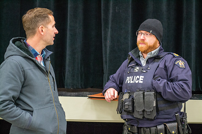 Rocanville School principal Nathan Bromm chatting with Moosomin RCMP Sgt. Damien Grouchy after the meeting.<br />
